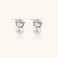 White gold stud earrings with square crystal stones in twisted frames and pink freshwater pearl drops below