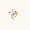 Gold ring with large iridescent baroque pearl and four colored gemstones on textured band